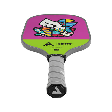 White Background Image: JOOLA x BRITTO paddle, grey handle, lime green and purple paddle face with an image of a cat in BRITTO art stye.