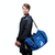 White Background Image: Ben Johns with Black and blue JOOLA Vision II Duffle Bag. #Blue