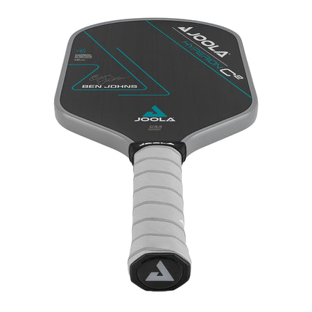 White Background Image: Ben Johns Hyperion C2 Pickleball paddle. Black surface with turquoise lines and Ben Johns' signature. Grey handle and grey edge guard with white JOOLA logo.