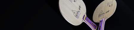 Black background horizontal banner image of two JOOLA table tennis rackets.