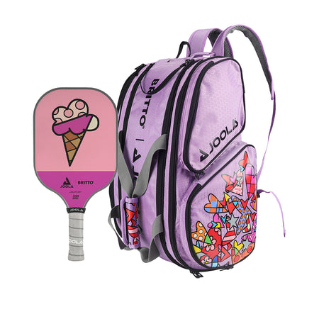 White Background Image: The JOOLA x BRITTO Sweet Serenity Bundle featuring JOOLA x Britto Ice Cream Paddle and the JOOLA x Britto Lavender Tour Elite Pickleball Bag. Paddle face features Britto inspired art of ice cream cone and bag is lavender in color with JOOLA logo and Britto art on the side.