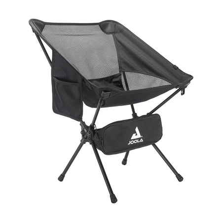 White Background Image: Black JOOLA Compact Portable Chair with mesh back panel, white JOOLA logo on inner left, foldable legs, and side pockets. Storage bag with white JOOLA stacked logo attached on legs.