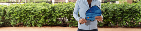 Banner image of someone holding a JOOLA Journey Pickleball Paddle.