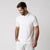 White background image, male model wearing a JOOLA Men's Club Polo, white.