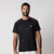 Image of a male model wearing a JOOLA Men's Court Short Sleeve Shirt, Black.