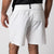 Close up image showing the branded woven pinch tab tag on the back of a pair of JOOLA Men's Woven Shorts, White.