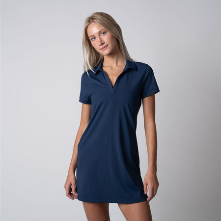 Female model wearing a JOOLA Women's Club Polo Dress, Navy.