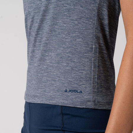 Close up image of the raised JOOLA logo on a Women's Club Short Sleeve Shirt. Navy Heather.