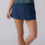 Image of a female model wearing a JOOLA Women's Pickleball Skort, Navy.